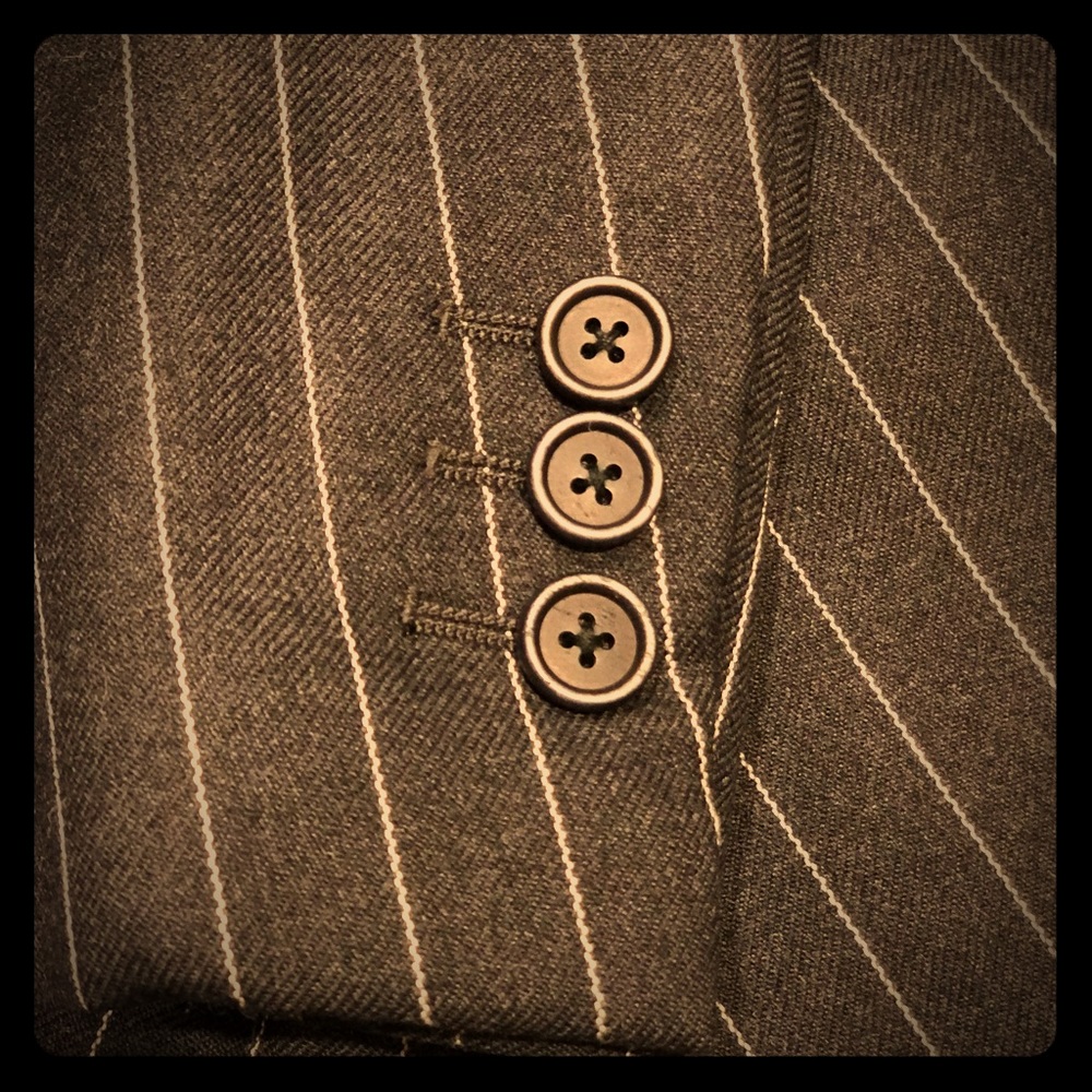 Charcoal/white chalk stripe suit by Romeo Gigli